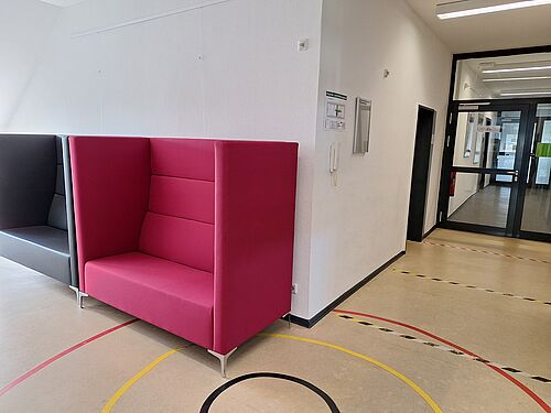 Picture of a two sofas and the door to the LingLabTU