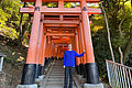 Student Dennis Kühn stands under a torii gate in Kyoto.