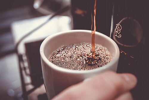 A coffee cup being filled